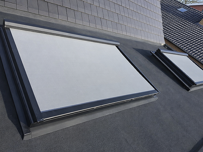 Skylights on dark gray rooftop